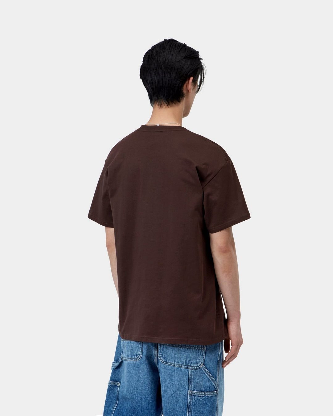 Carhartt WIP S/S Chase T-Shirt in Palisander / Gold, back view, worn with blue jeans.