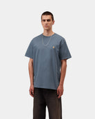 Carhartt WIP S/S Chase T-Shirt in Icesheet / Gold, front view, with gold embroidered chest logo, shown on model.