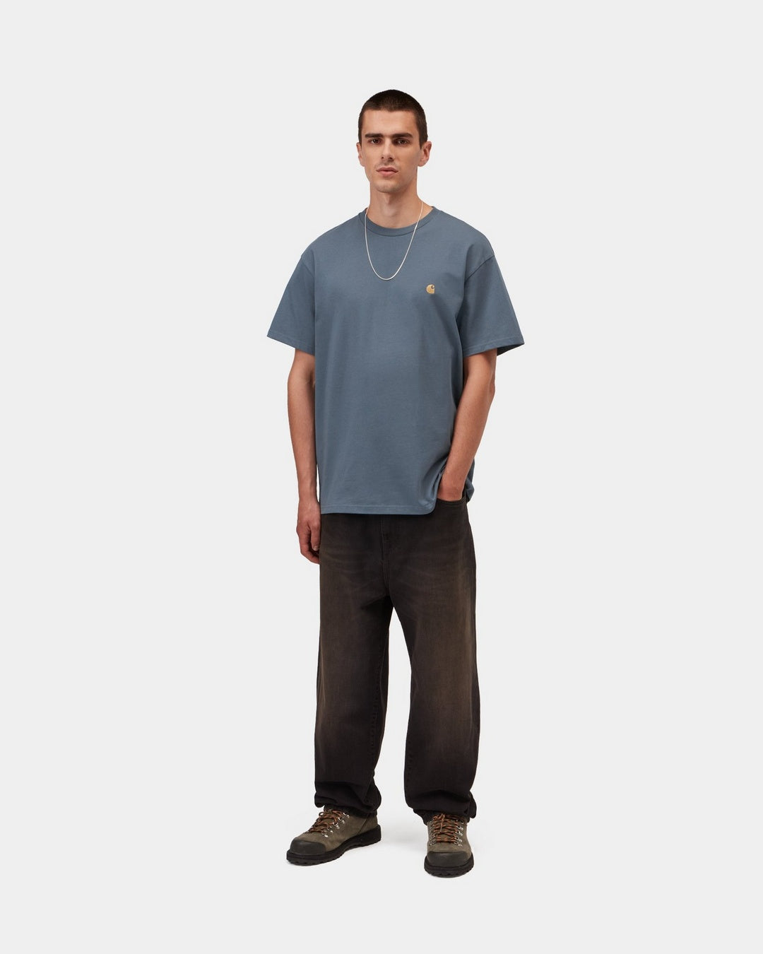 Carhartt WIP S/S Chase T-Shirt in Icesheet / Gold, front view, worn by model with small embroidered chest logo.
