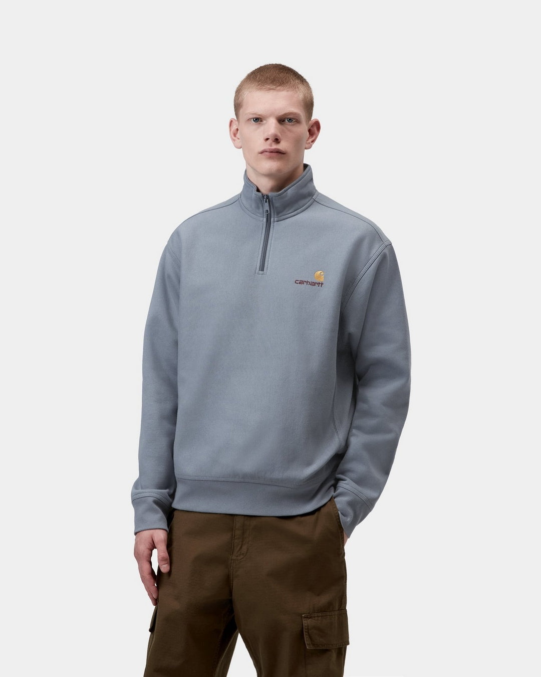 Carhartt WIP Half Zip American Script Sweatshirt in Shady Blue, front view, with half-zip high neck and small chest logo.