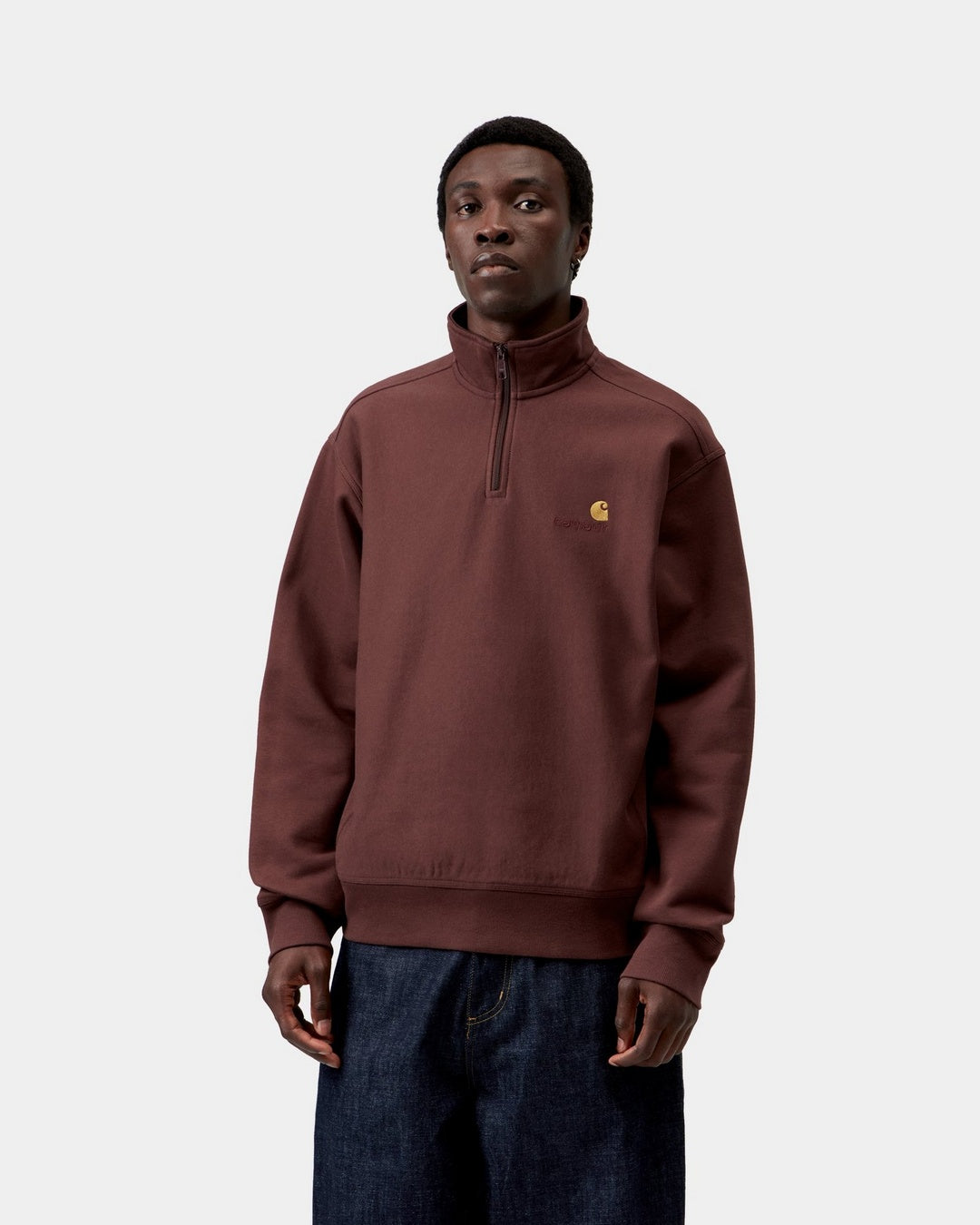 Carhartt WIP Half Zip American Script Sweatshirt in Amarone, shown front view with a high neck half-zip and small chest logo, shown on model.
