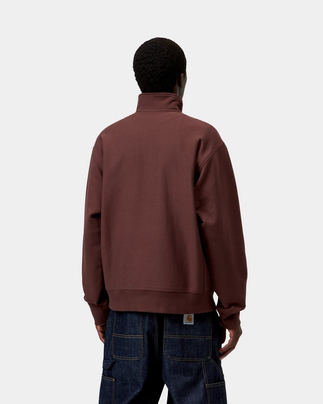 Carhartt WIP Half Zip American Script Sweatshirt in Amarone, back view, worn with a high neck and loose fit.