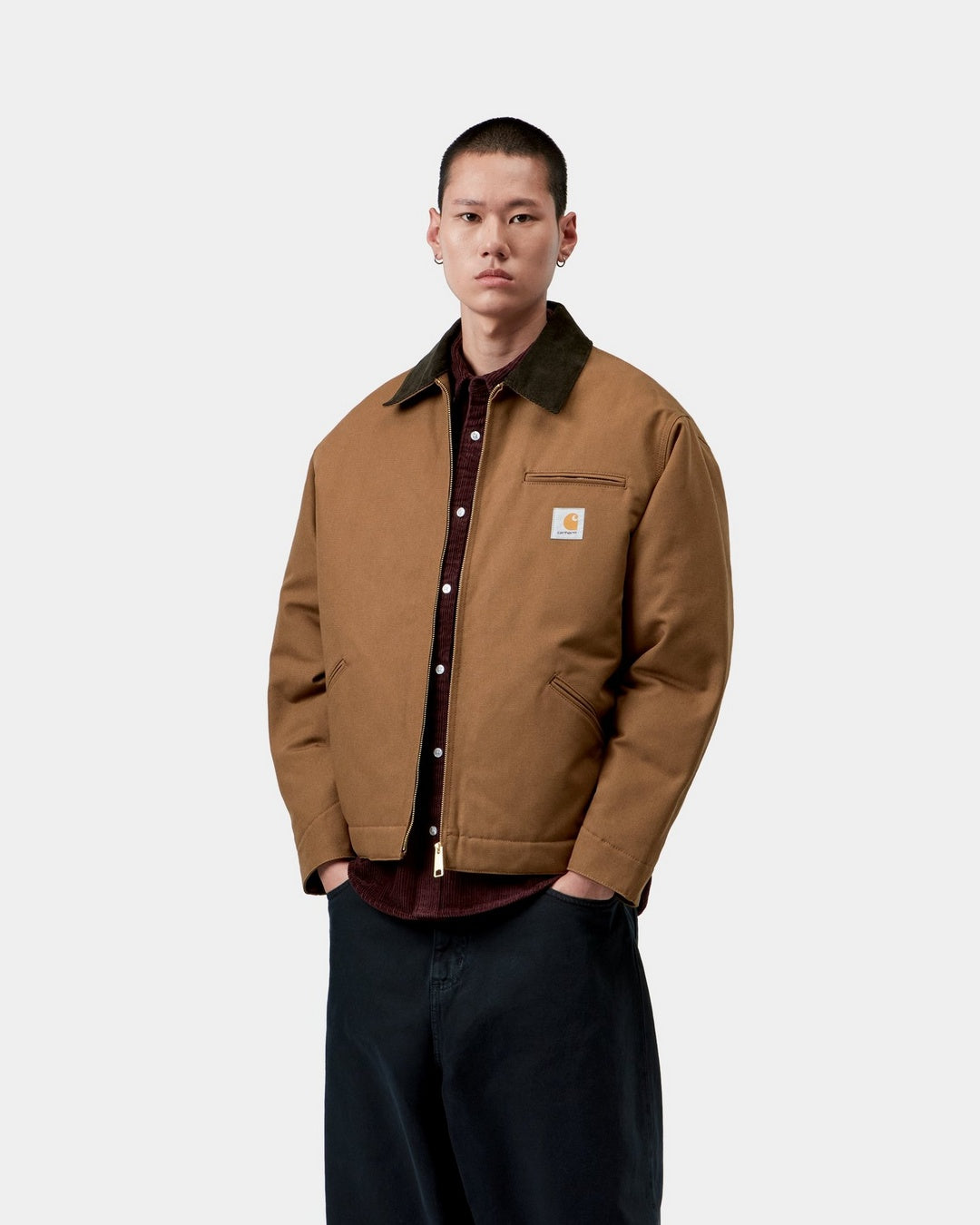 Carhartt WIP OG Detroit Jacket in WIP H Brown / Tobacco, front view, with corduroy collar, chest pocket and zip front, shown on model.