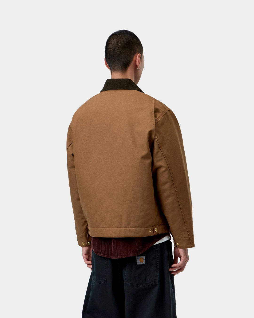 Carhartt WIP OG Detroit Jacket in WIP H Brown / Tobacco, back view, with a corduroy collar and adjustable hem tabs, shown on model.