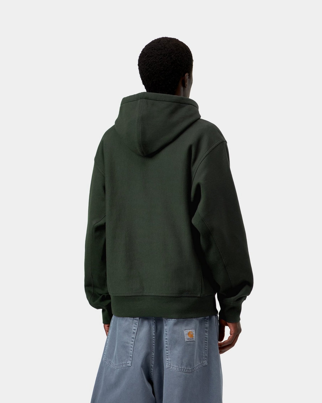 Carhartt WIP Hooded American Script Sweatshirt in Raven, back view, showing the hooded sweatshirt with ribbed hem and cuffs, shown on model.