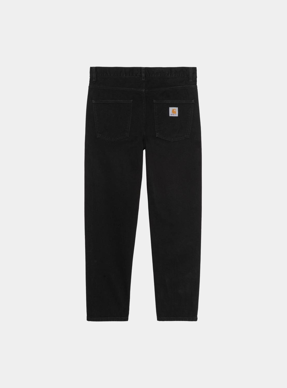 Carhartt WIP Newel Pant in Black, back view, with five-pocket styling and Square Label on the rear pocket.