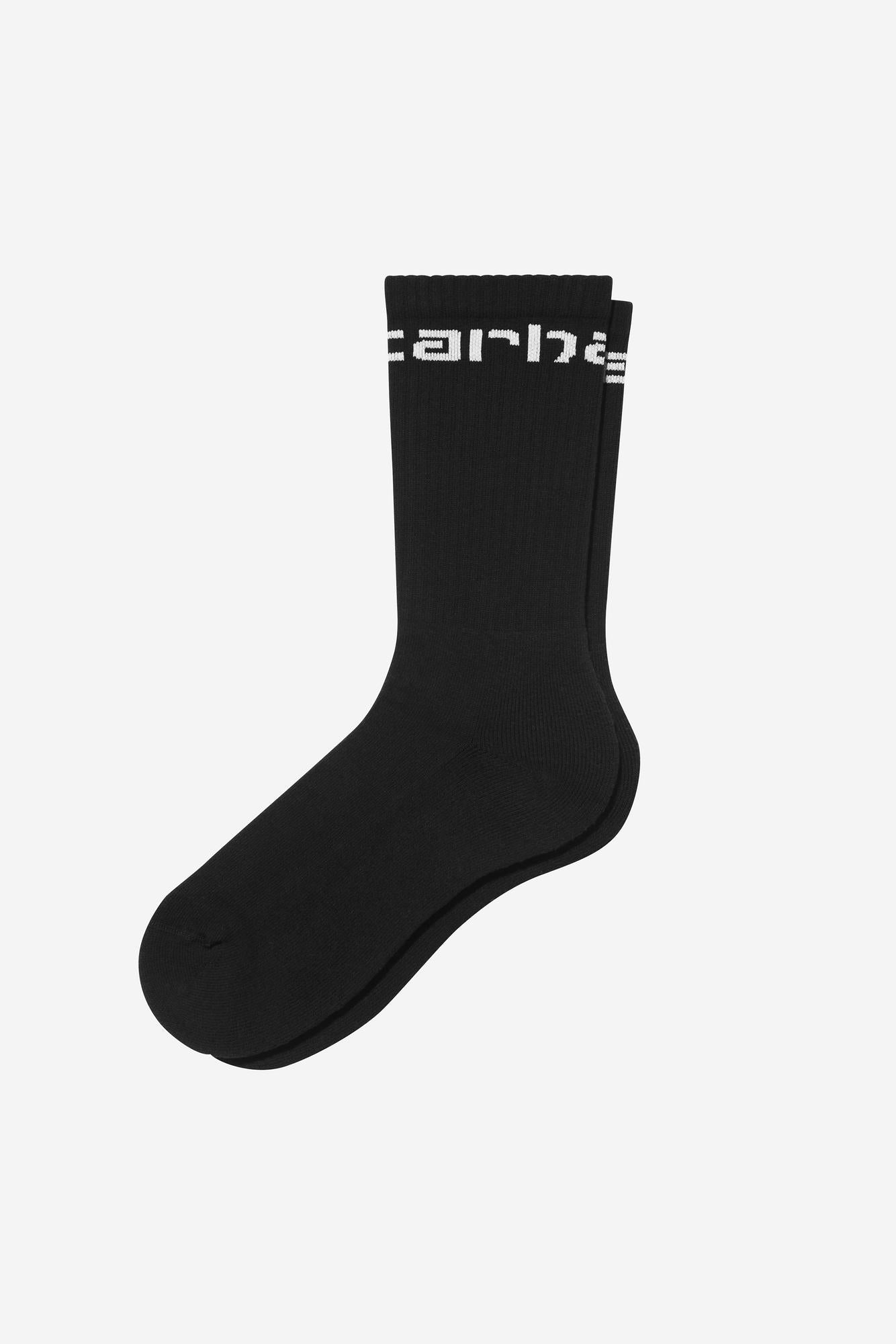 Black sock with white branding on a light gray background