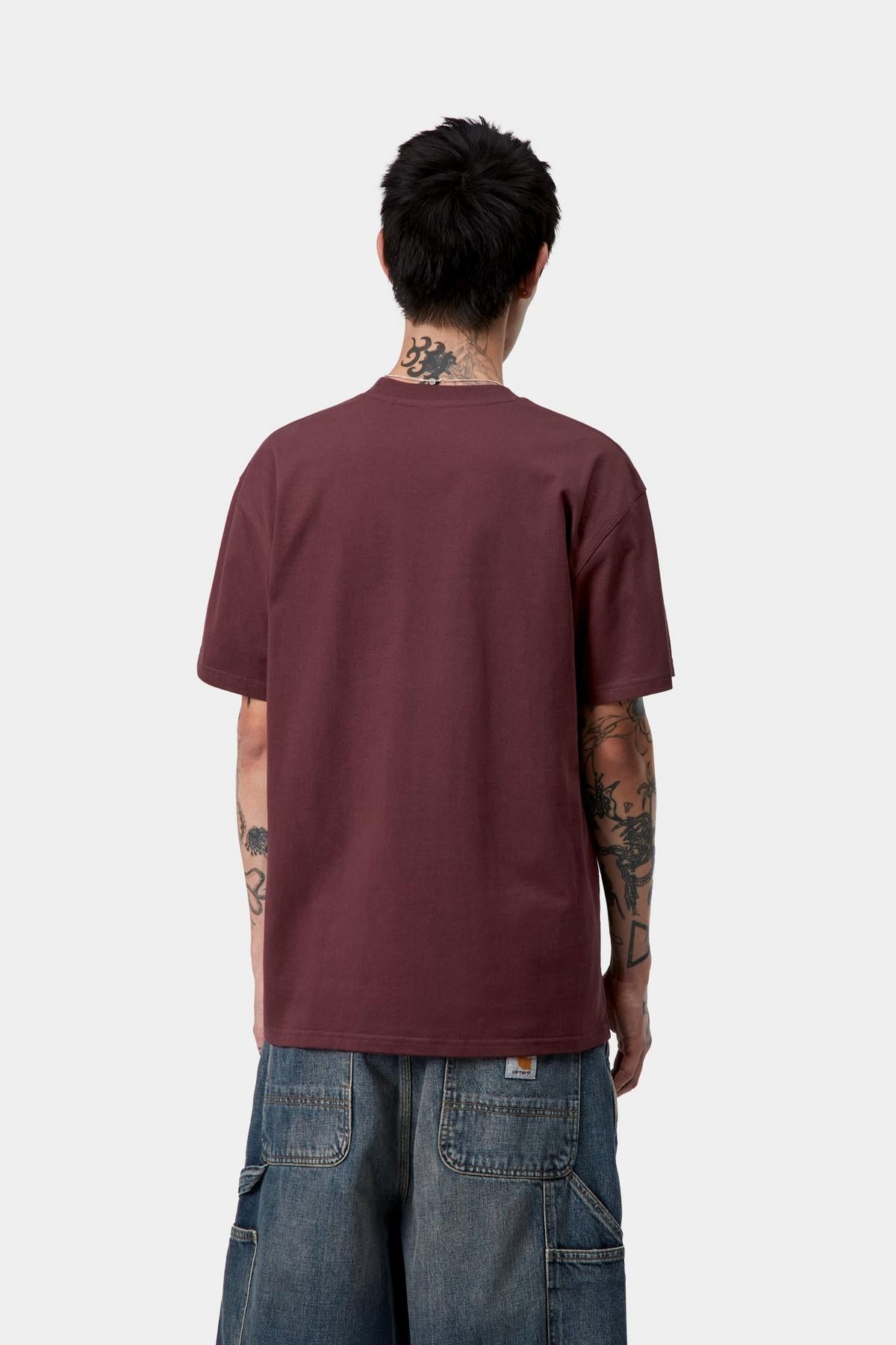 Person wearing a maroon t-shirt and blue jeans on a white background