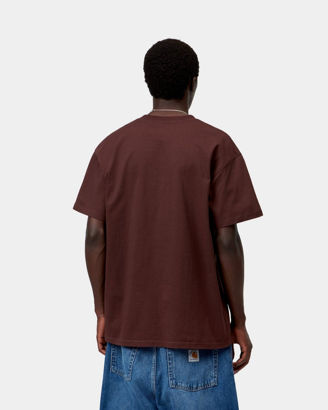 Carhartt WIP S/S American Script T-Shirt in Amarone, back view, worn with blue jeans.