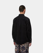 Carhartt WIP L/S Madison Cord Shirt in Soot, back view, showing corduroy texture and curved hem, shown on model.