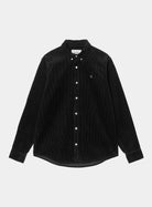Carhartt WIP L/S Madison Cord Shirt in Soot, front view, showing button-down collar, chest logo, and curved hem.