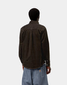 Carhartt WIP L/S Madison Cord Shirt in Tobacco, back view, showing corduroy texture and buttoned cuffs, shown on model.