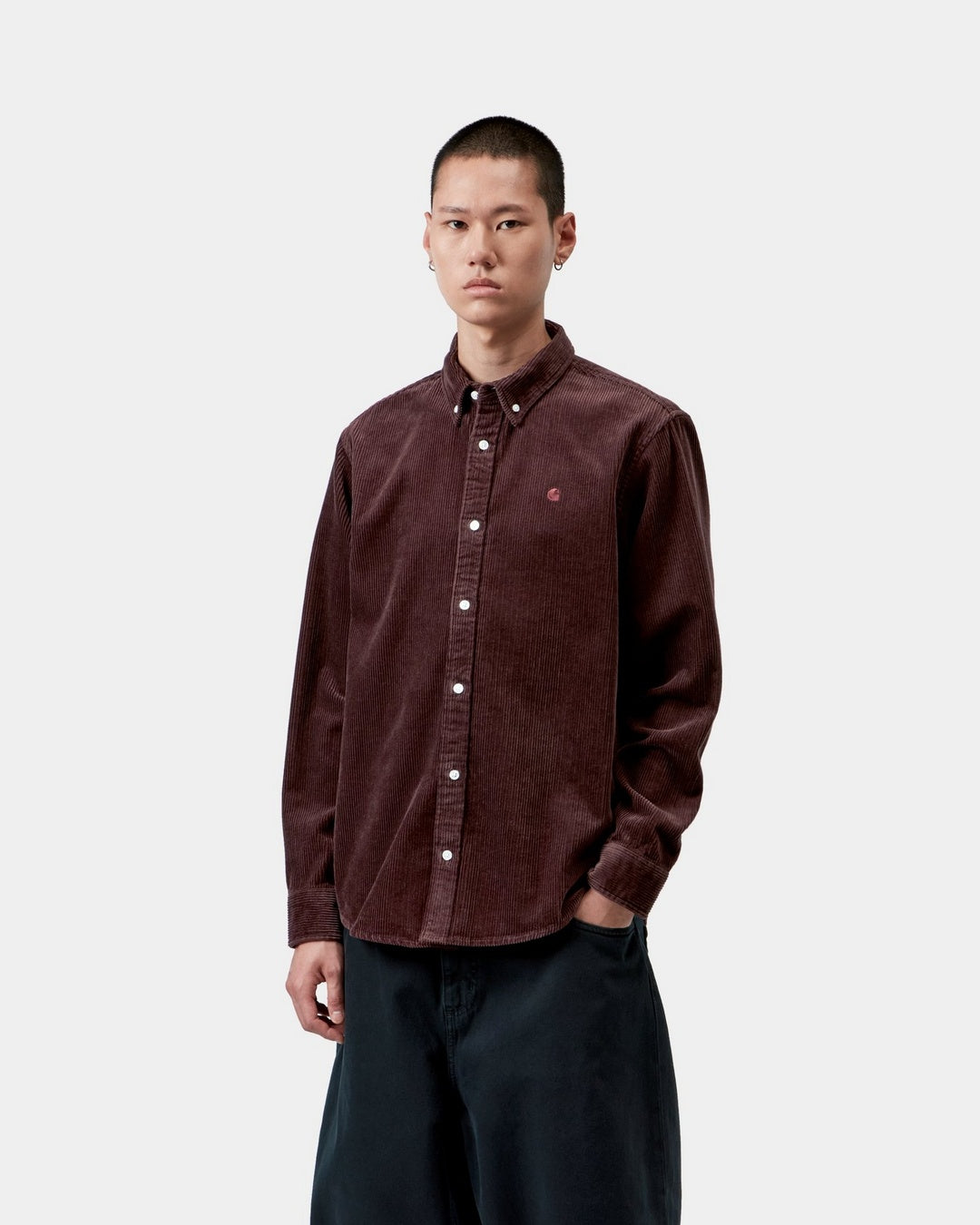 Carhartt WIP L/S Madison Cord Shirt in Amarone, shown on model with front view, button-down collar, long sleeves, and chest logo embroidery.