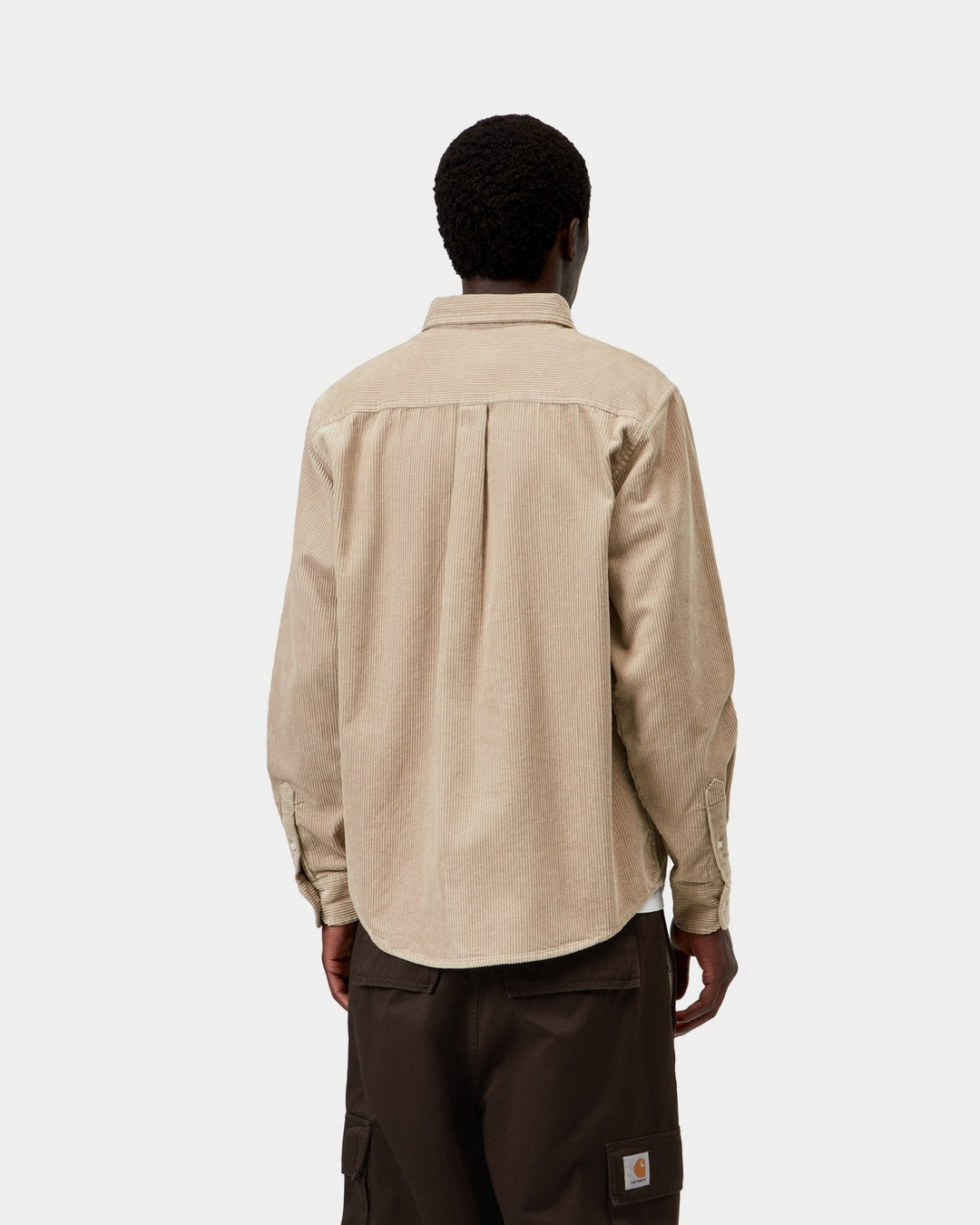 Carhartt WIP L/S Madison Cord Shirt in Wall, back view, showing corduroy texture, curved hem and long sleeves, shown on model.