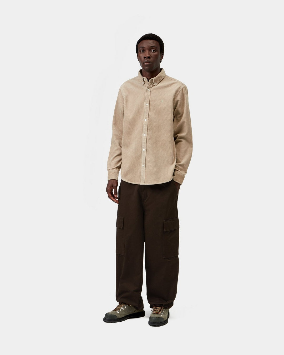 Carhartt WIP L/S Madison Cord Shirt in Wall, front view, worn by model with button-down collar and chest logo