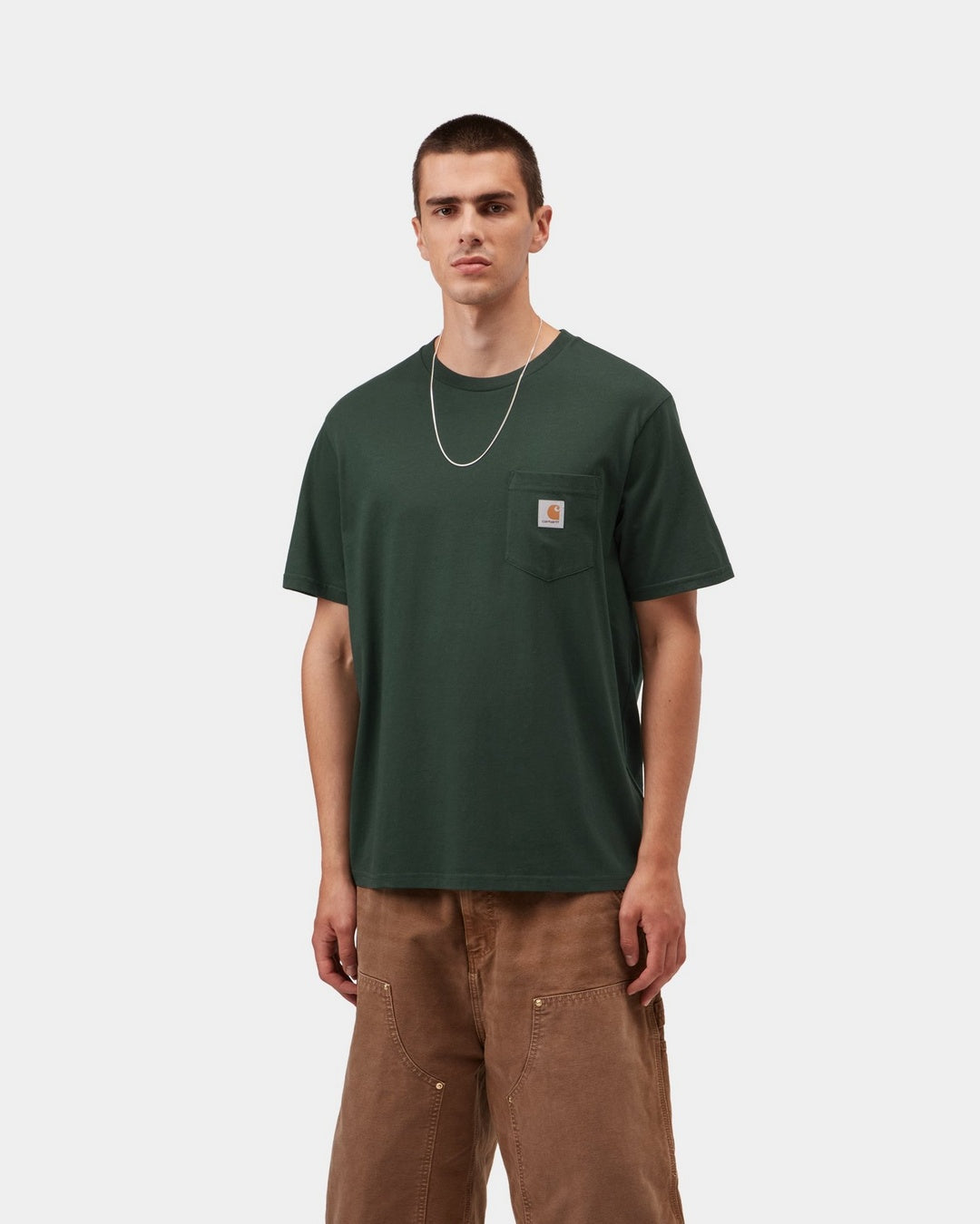 Carhartt WIP S/S Pocket T-Shirt in Dark Scarab, front view, with chest pocket and logo label.