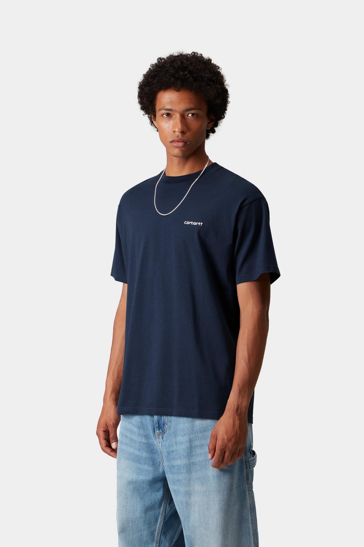 Man wearing a navy t-shirt with a logo on a white background