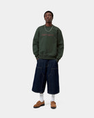 Carhartt WIP Carhartt Sweatshirt in Dark Scarab with Palisander script logo, worn front view on model