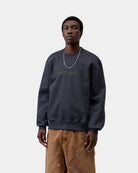 Carhartt WIP sweatshirt in Dark Navy / Dark Scarab with embroidered logo on the chest, shown on model from the front.