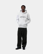 Carhartt WIP Hooded Carhartt Sweatshirt in Ash Heather / Graphite, shown on model with hood up, front view, kangaroo pocket and chest logo visible.