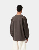 Back view of a Carhartt WIP L/S Vista T-Shirt in Tobacco, showing the loose fit, long sleeves, and ribbed cuffs, shown on model.