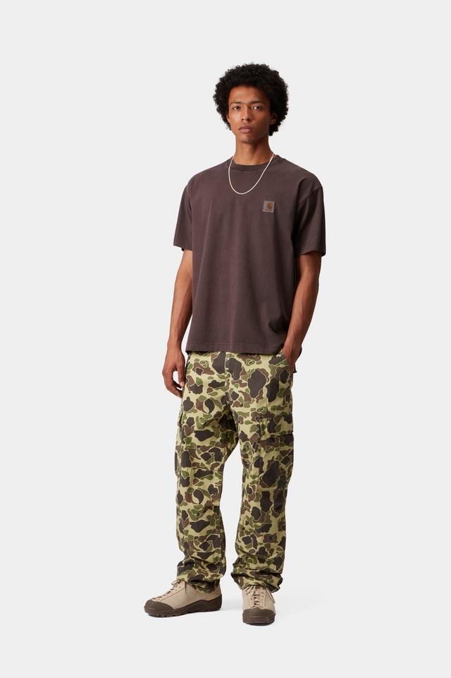 Person wearing a brown t-shirt and camouflage pants on a white background