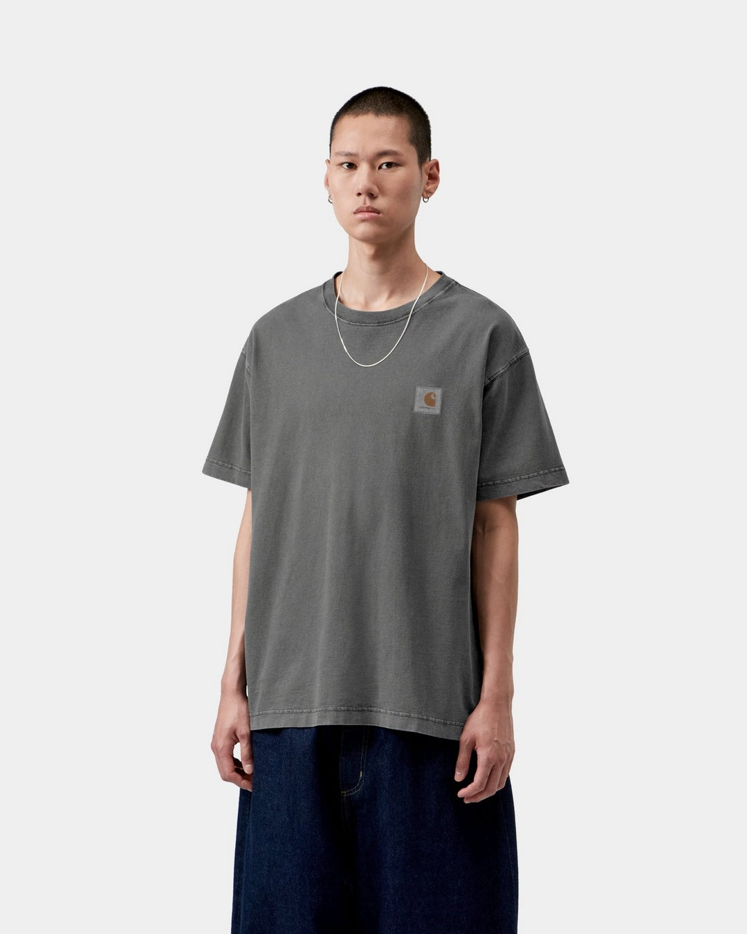 Carhartt WIP S/S Vista T-Shirt in Black, front view, with a small chest logo label and relaxed fit, shown on model.