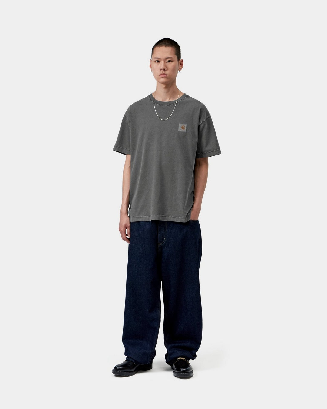 Carhartt WIP S/S Vista T-Shirt in Black, front view on model with short sleeves and a small chest label.