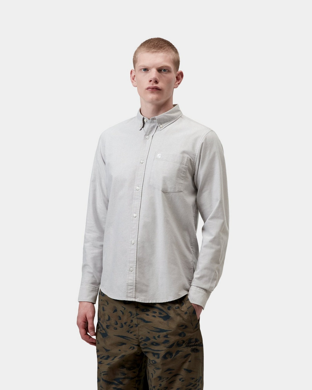Carhartt WIP L/S C-Logo Shirt in Shady Grey / White, shown worn by a model in front view with button-down collar, chest pocket and long sleeves.