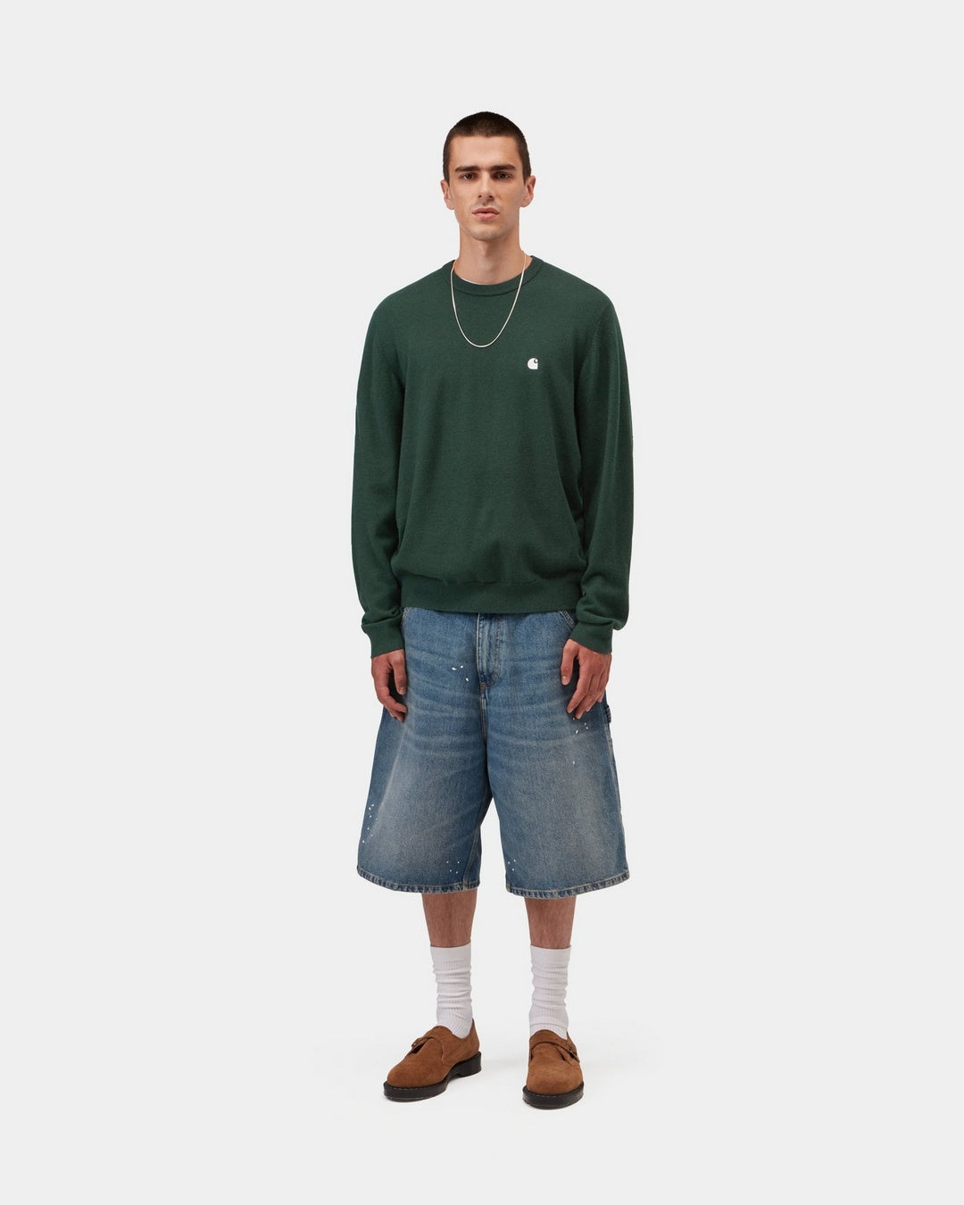 Carhartt WIP Madison Sweater in Dark Scarab / Wax, shown on model with embroidered chest logo, ribbed cuffs and hem.