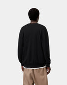 Carhartt WIP Madison Sweater in Black / Wax, back view, worn over layered clothing.