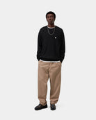 Carhartt WIP Madison Sweater in Black / Wax, shown on model with embroidered chest logo.