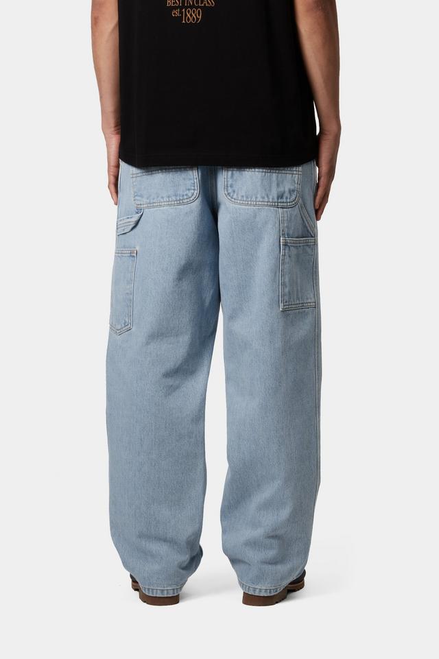 Light blue jeans worn by a person on a white background