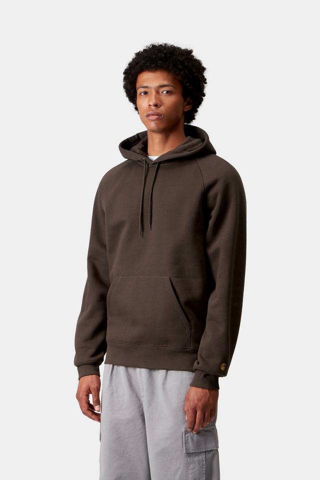 Man wearing a brown hoodie on a white background
