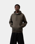 Carhartt WIP Hooded Chase Sweatshirt in Shungite / Gold, front view, with kangaroo pocket and hood drawcords.