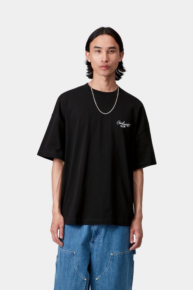 Person wearing a black t-shirt with a logo on a white background