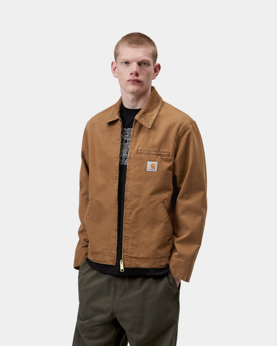 Carhartt WIP Detroit Jacket in Hamilton Brown / Hamilton Brown, front view with corduroy collar, chest zip pocket, and woven logo label.