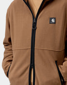 Carhartt WIP Blevin Liner in WIP H Brown, front view with full-zip closure and Square Label patch on chest, shown on model.