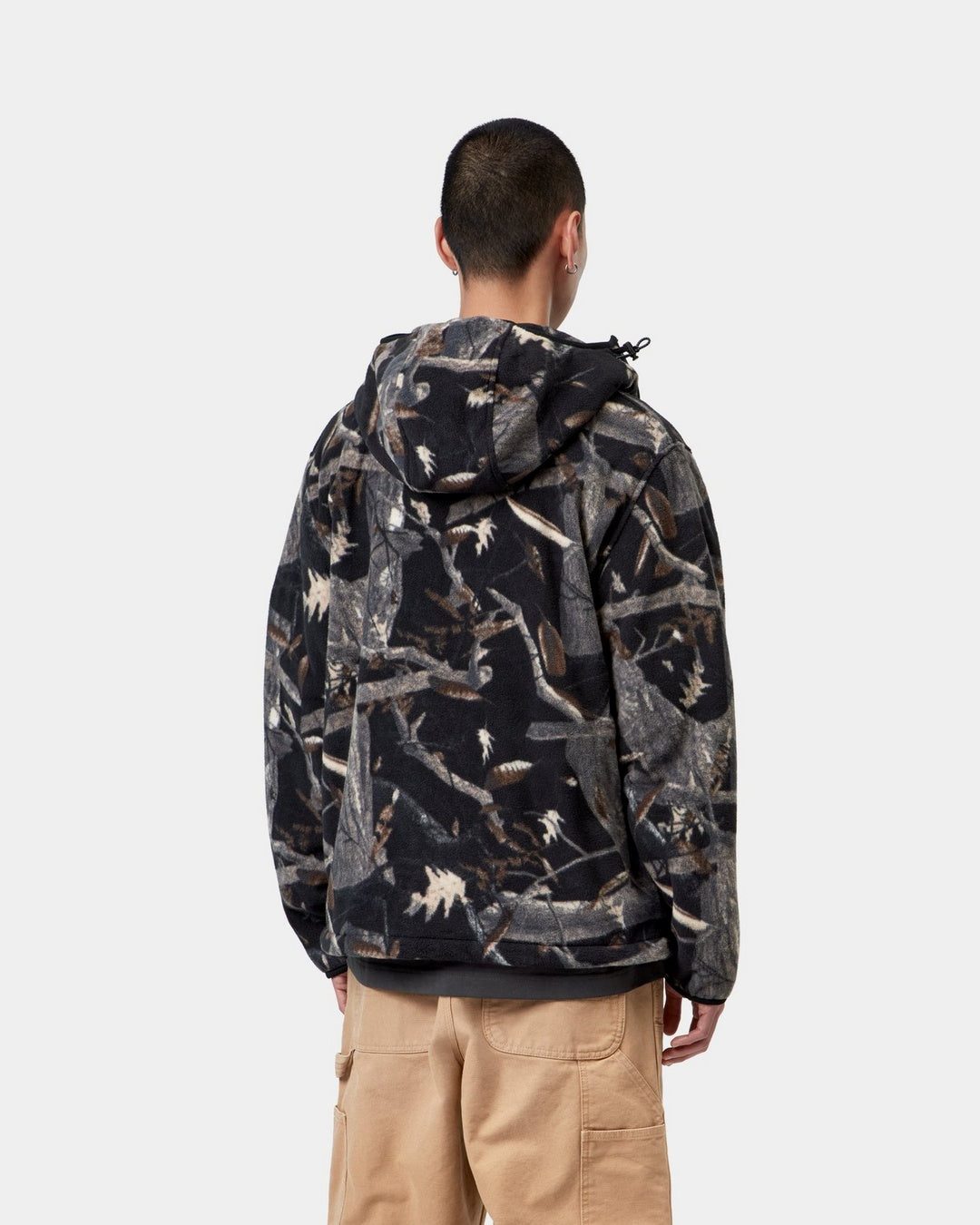 Carhartt WIP Blevin Liner in Camo Feather Tree, Black, shown from the back with hood up, shown on model.