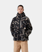 Carhartt WIP Blevin Liner in Camo Feather Tree, Black, shown front view with full zip, hood, and chest logo patch, shown on model.