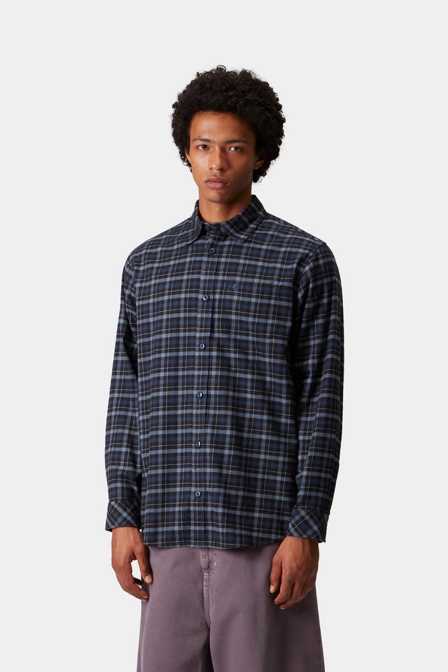 Man wearing a plaid shirt on a white background