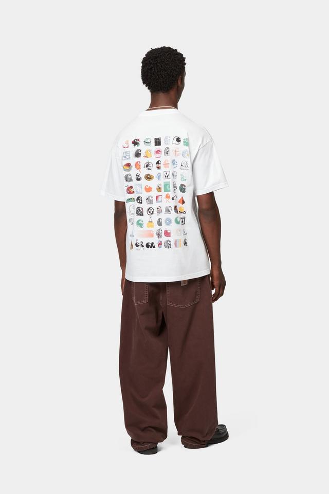 Person wearing a white t-shirt with colorful graphics on the back, standing against a white background
