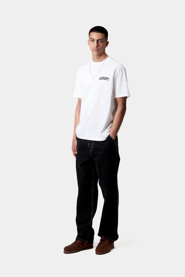 Person wearing a white t-shirt with text and dark jeans on a white background