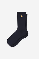 Carhartt WIP Chase Socks in Dark Navy / Gold, product view of navy crew socks with an embroidered gold C Logo.