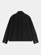 Back view of the Carhartt WIP Atoka Shirt Jac in Black, showing a collared neckline, a horizontal back yoke with a centre box pleat below, and long sleeves with buttoned cuffs.