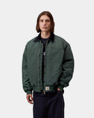 Carhartt WIP OG Santa Fe Jacket in Raven / Black, front view, worn open with corduroy collar and square label visible.