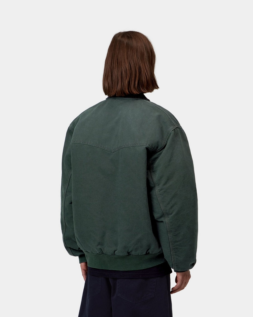 Carhartt WIP OG Santa Fe Jacket in Raven / Black, back view, with rib-knit hem and cuffs, shown on model.