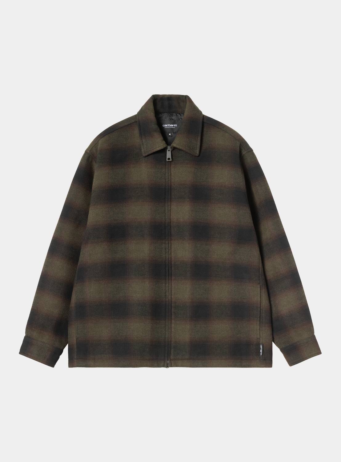 Carhartt WIP Alton Jacket in Alton Check, Cypress, front view. The jacket features a large-scale check pattern in dark green and black tones, a pointed collar, and a full-length zip closure with a silver-tone pull. A woven flag label is visible on the lower left side seam near the hem.