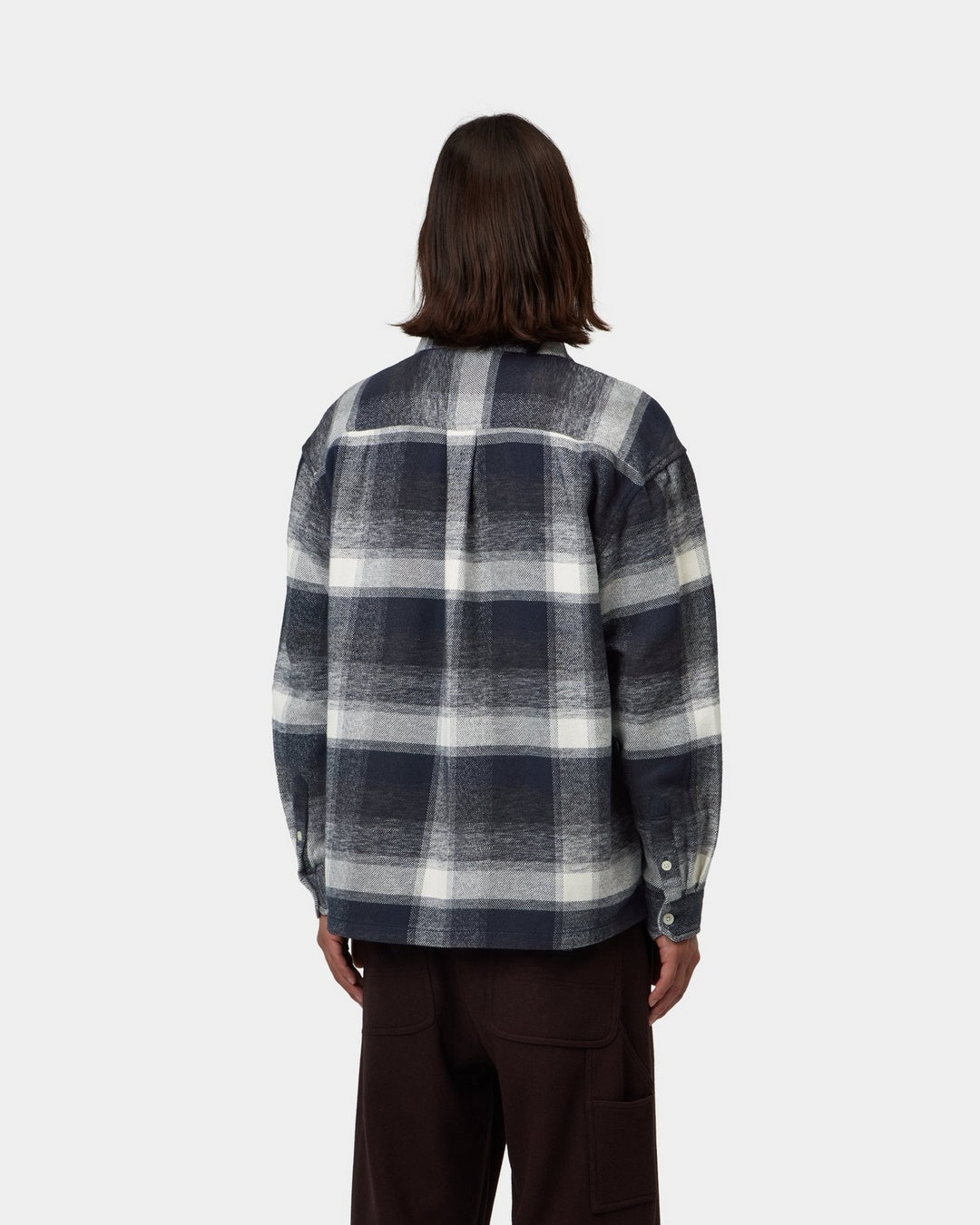 Carhartt WIP L/S Esterson Shirt in Esterson Check, Dark Navy, shown from the back with an allover check pattern, shown on model.