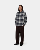 Carhartt WIP L/S Esterson Shirt in Esterson Check Dark Navy, front view, worn by model with buttoned chest pockets and Square Label.